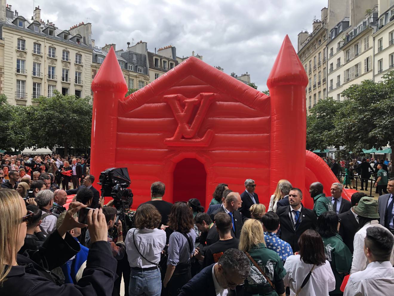 A red bouncy castle in the middle of a beautiful square in Paris