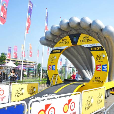 Art and Design Art and marketing come together Inflatable departure gate installed on trailer for races against timetime race during Tour de France designed by architects Patrick Mellet and Martin Francis for Amaury Sports Organisation X-Treme Creations