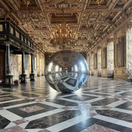 Art and Design Art and marketing come together inflatable airtight sphere silver mirror 3 meter diameter reflecting in Danish castle X-Treme Creations