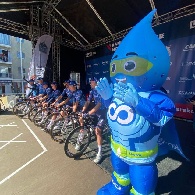 X-Treme Creations Man inside blue inflatable walker suit - Hydro Hero - cheering on cyclists as they are about to race