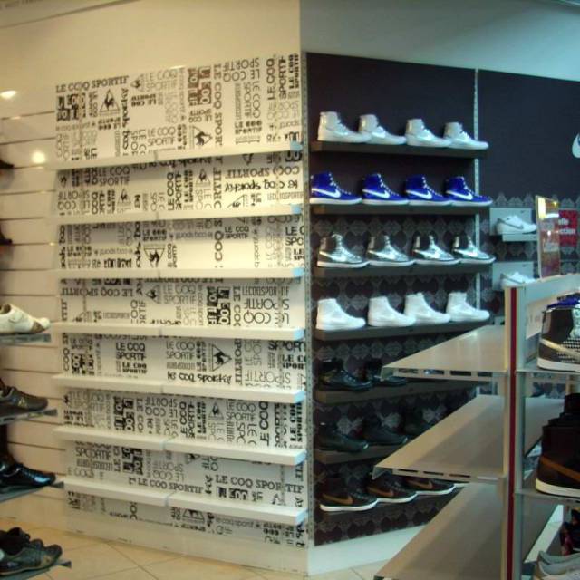 Large format print displays digital printed cardboard Le Coq Sportif and Nike as backside of a shoe display X-Treme Creations