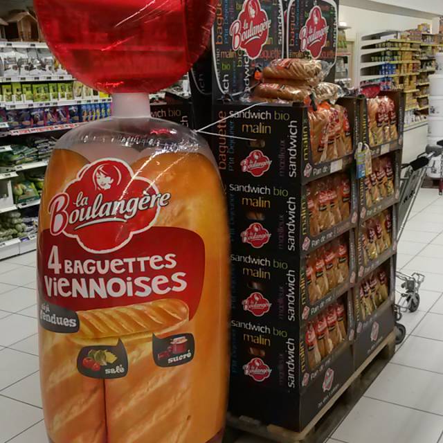 Miniature inflatable product enlargements inflatable airtight bread bag with 4 Baguettes Viennoises La Boulangère inside the supermarket as POS eye-catcher X-Treme Creations