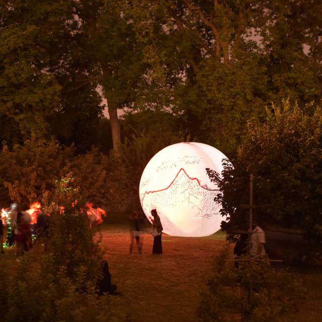 Giant inflatable spheres inflatable handpainted 5 m diameter sphere by the Eé summerschool students with moving image projections in the former gardens of Louis XIV in the city of Versailles for the 400th birthday X-Treme Creations