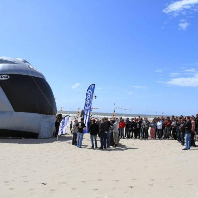 Giant inflatable stands Inflatable large helmet as Araï stand for event on the beach for race pilots X-Treme Creations