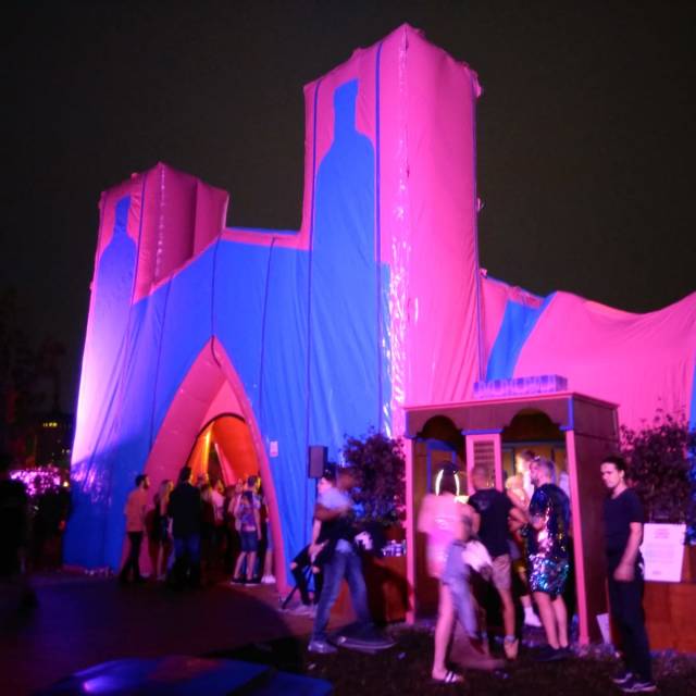 Giant inflatable stands inflatable rollerskating temple in the shape of the Absolut cathedral of 16 meter long and 9 meter wide during the worldwide Elrow Festivals X-Treme Creations