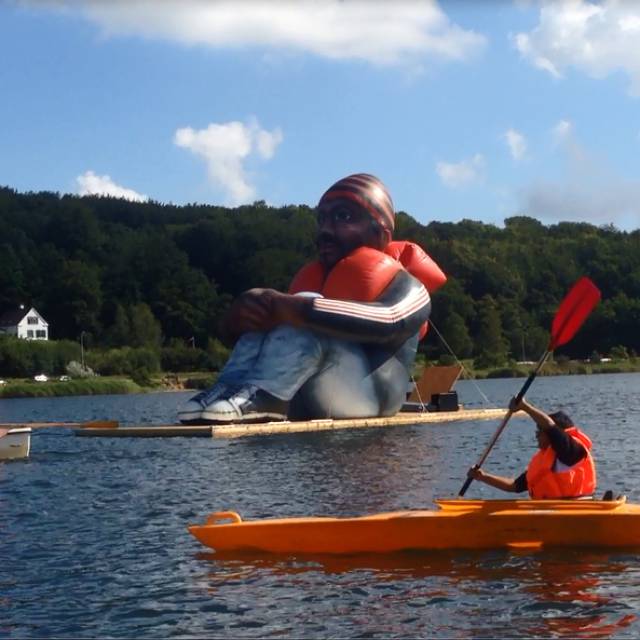 X-Treme Creations Boat with giant inflatable fugitive on Lake in Sweden