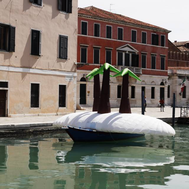 X-Treme Creations inflatable island with palm trees representing Madagascar made for the artist Sören Dangaard on top of a Venitian gondola during the Biennale