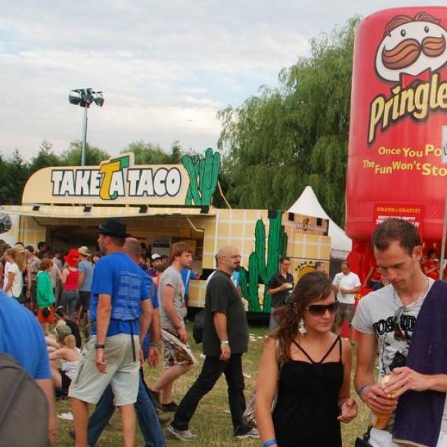 Giant inflatable product enlargements inflatable giant tube of Pringles as a sales booth for Procter and Gamble during the Werchter Festival amongst others X-Treme Creations