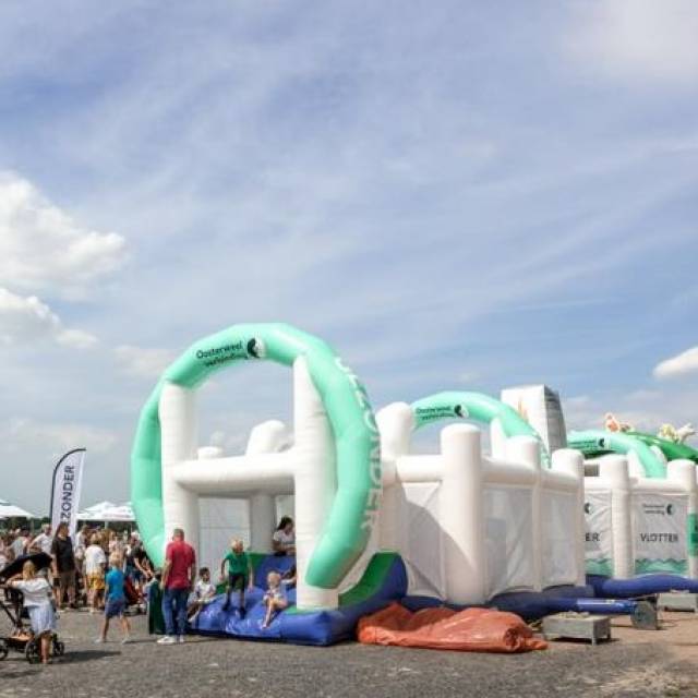 Giant inflatable games tailor made inflatable survival run Oosterweel along the river Schelde in the city of Antwerp X-Treme Creations