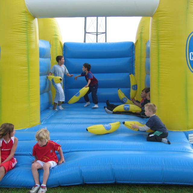 Giant inflatable games Inflatable tailormade bouncer following EN14960 with 4 bananas in the corner for Chiquita Germany X-Treme Creations