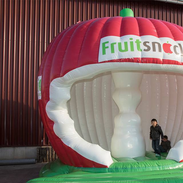 Bouncer Fruitsnacks Giant inflatables 3D apple shaped bouncy castle with a nibbled bell house X-Treme Creations