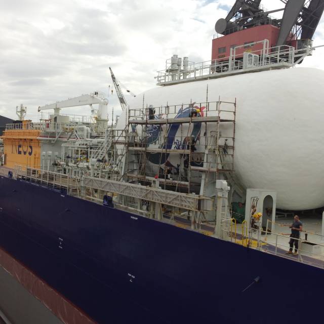 X-Treme Creations Dragon vinyl stickering without scalfolding by X-Treme team on the LNG cylinder of the vessel JS Intuition at the  Fayard shipyard in Odense Havn