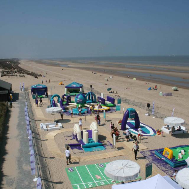 Giant inflatable games aereal picture of an entire inflatable games village Pampers branded for Procter and Gamble in order to improve Psychomotor therapy at the Belgian coast installed by the agency We Make You Happy X-Treme Creations