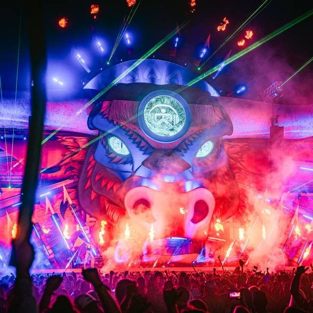 X-Treme Creations Airbeat One Festival - illuminated stage in the shape of a bull with inflatable horns by night