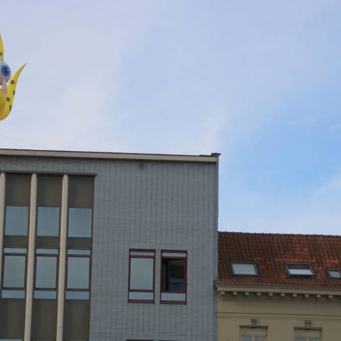 Inflatable News Giant yellow inflatable monster on top of building in Antwerp, for Antwerp on Air X-Treme Creations