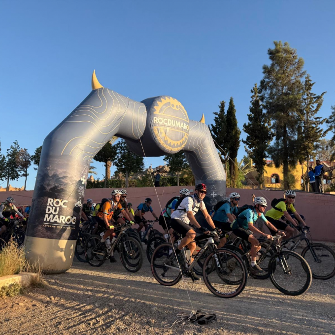 Inflatable News inflatable arch with cyclists underneath, in Morroco, sun shining X-Treme Creations