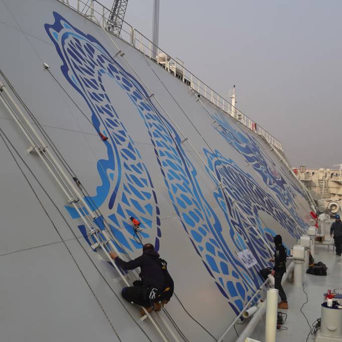 Large format print in every tint | X-Treme Creations X-Treme installation team installing the vinyl on the belly of the VLEC Marlin in the Chinese port of Dalian  Art and Design  & Corporate branding  &  Evergas X-Treme Creations