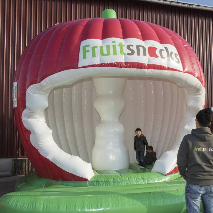 Large inflatable promotional material | X-Treme Creations 3D apple shaped bouncy castle with a nibbled bell house Events  & Fairs  & Corporate branding  & Brand activation  &  Fruitsnacks X-Treme Creations